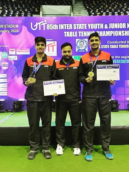 Standing on the national podium with my players Aakash K J and his doubles partner Rohith Shankar. Moments like these make all the hard work worthwhile.