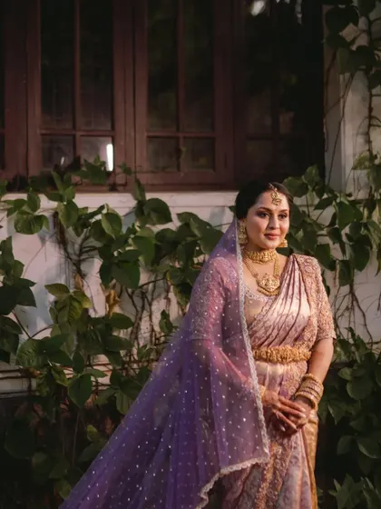 A beautiful portrait of the bride with her shimmering purple veil.