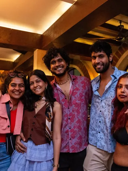A happy group of friends posing for a picture during our Sunday karaoke night.