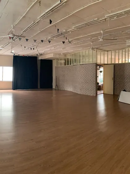 Our main studio space, clean, open, and ready for movement. This is where the magic happens, a blank canvas for our dancers to fill with energy and art.