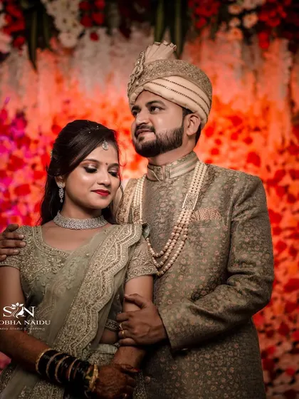 A regal reception portrait. Shilpa's elegant lehenga and her partner's sherwani are complemented by her sophisticated makeup and hairstyle.