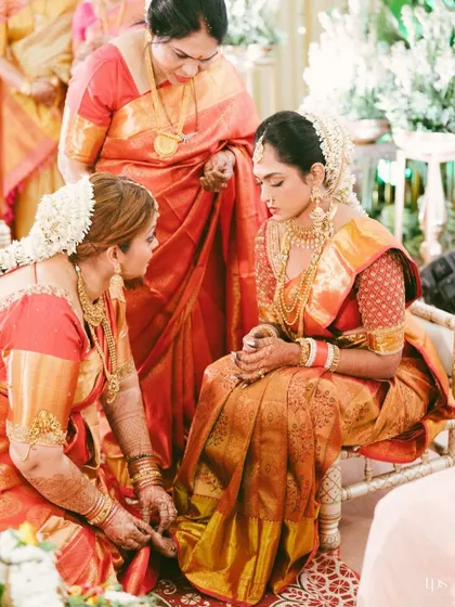 A traditional moment during a South Indian wedding, as the bride receives blessings from her family. This photo captures the importance of family and ritual.