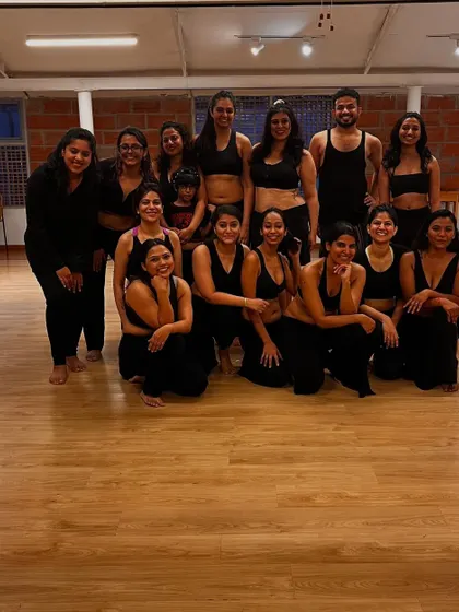 A group photo filled with joy. We are a community that supports and uplifts each other, both on and off the dance floor.