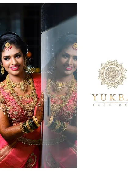 A radiant bride on her special day. She is wearing a custom pink blouse with elaborate shoulder detailing and beadwork, perfectly complementing her traditional South Indian bridal look.