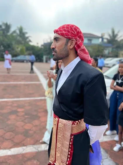 A candid moment during a family wedding, dressed in the traditional Kodava kupiya chele. These events are an important part of my life, connecting me to my roots and the community here in Coorg.