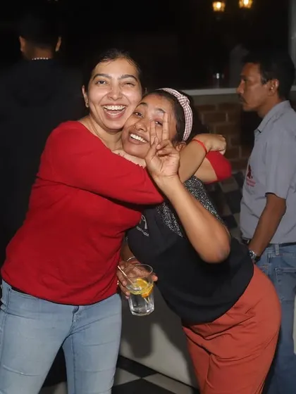 Pure joy and friendship captured in a candid moment. This is the energy that defines a night at Sherlock's.