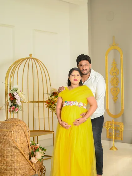 This couple looks radiant in our classic studio setup. The yellow gown brings so much brightness and joy to their maternity photos.