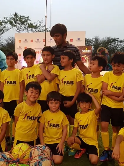 A large team photo. Football becomes a medium through which young players absorb life skills, setting the foundation for their holistic development.
