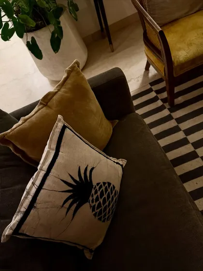 A close-up of the textures in my living room. I love mixing patterns and materials, like this pineapple print cushion against the simple sofa fabric.
