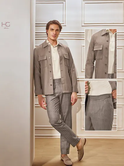 Pinstripes are reimagined in this look, featuring a flannel shacket and matching trousers. The earthy tones and relaxed fit create a tailored casual outfit that is perfect for cooler weather.