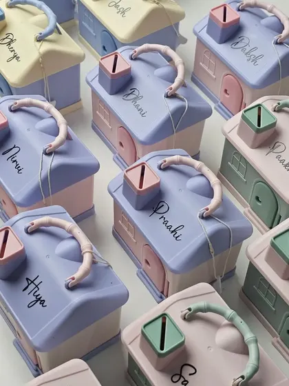 A closer look at the detail on our personalized piggy banks. They are a fun way to teach kids about saving and make for a memorable party favor.