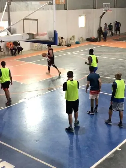 A team gets organized on defense during a pickup game. You can book our court for both half-court drills and full-court scrimmages.