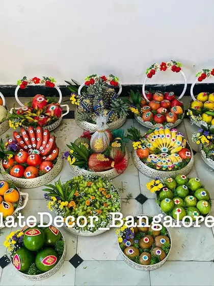 Here is a large collection of fruit platters I prepared for a single event. It shows my capacity to handle bulk orders while ensuring each platter, from decorated pomegranates to avocados, is unique and vibrant.
