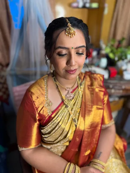A close-up of the makeup for the naming ceremony. I created a soft, shimmery eye look with a warm lip color that photographed beautifully.