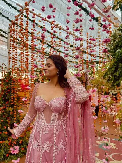 This pink corset Anarkali is a perfect example of modern ethnic wear for pear-shaped bodies. The corset snatches the waist, the puff sleeves broaden the shoulders, and the Anarkali flare flows beautifully over the hips.
