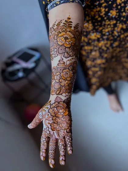 A side view showcasing the flow of the floral pattern along the arm. I design my henna to look beautiful from every angle, not just the front.