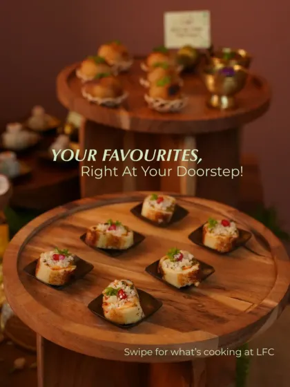 Your favorites, right at your doorstep. This image displays a beautiful two tiered wooden stand with a variety of my bite sized appetizers, elegantly arranged and ready for a party.