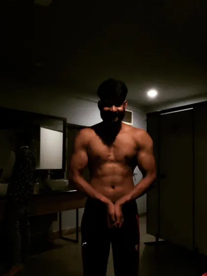 A solo shot from our posing session, capturing the shadows and muscle definition.