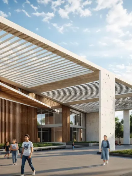 Another view of the entrance plaza, showing how students and visitors can gather and interact in the space. The seamless transition from the paved plaza to the green lawn and the covered walkways demonstrates our commitment to creating functional and people-friendly campus environments.