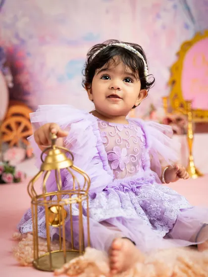 A curious princess exploring her magical kingdom. Props like this golden lantern add a touch of enchantment to the fairytale theme.