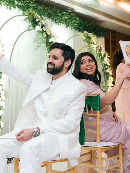 A fun wedding game in progress! The couple's reactions and the lively atmosphere make for fantastic, memorable photos.