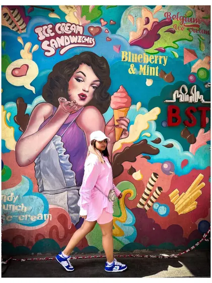 Not your vanilla. Another look at my street style outfit against a vibrant mural, showing how fashion can be playful and expressive.
