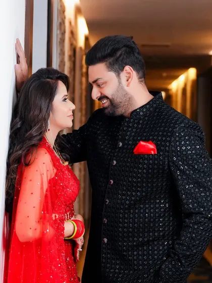 A classic romantic pose, with the couple gazing lovingly at each other. This shot captures the chemistry and connection that is at the heart of our photography.