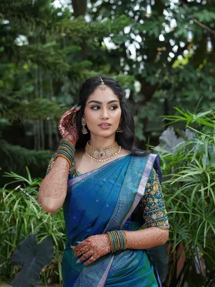 A thoughtful pose showing off the soft waves in her hair and the subtle shimmer on her eyelids. This engagement makeup is all about understated elegance.