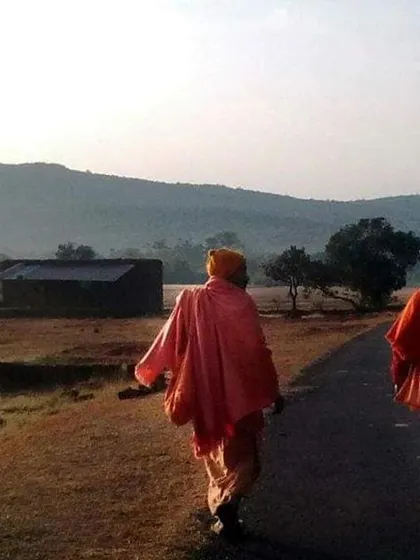 Two swamis on a morning walk along the quiet roads of Amboli. The simple, disciplined lifestyle of the ashram is the foundation of our spiritual practice.