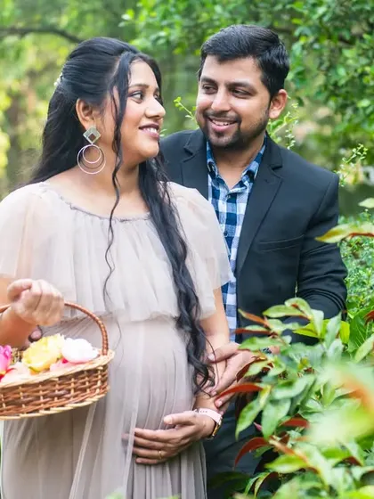 A candid moment captured as the couple walks through a garden. The genuine smiles and natural interaction are what make photos like this so special.