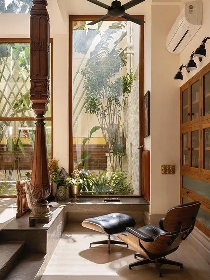 This design showcases a British Colonial style, reinterpreted for a modern Indian home. I love this trend for its fusion of classic elegance with rich textures, dark woods, and tropical plants, creating a nostalgic and luxurious atmosphere.