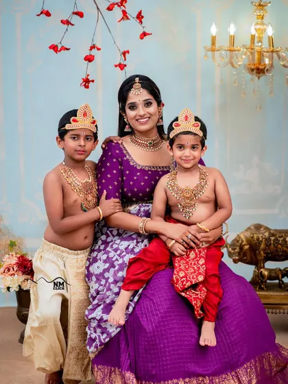 Capturing 'Yashoda' with her two little Krishnas was double the fun. We love accommodating siblings in our themed shoots to create a complete and heartwarming family memory.
