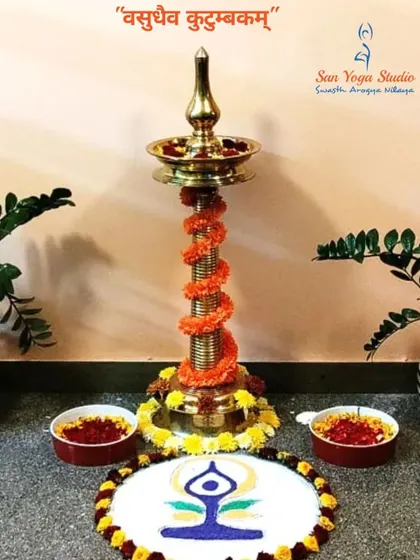 A beautiful setup at our studio for the 2023 International Day of Yoga. The Sanskrit phrase 'Vasudhaiva Kutumbakam' means 'The World Is One Family', which is the guiding principle of our community.