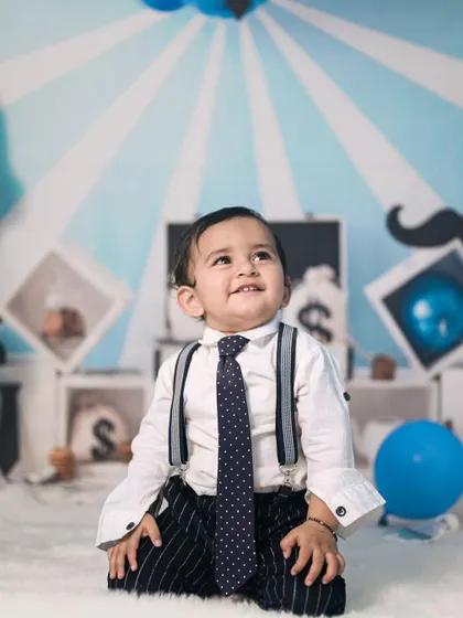 A classic portrait from the Boss Baby session. The simple, direct pose with the themed background creates a clean and charming photo that highlights his adorable expression.