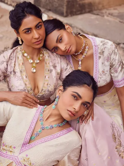 A group shot where the focus is on the variety of jewellery styles. Each model wears a different set, showcasing my ability to select the right pieces for different face shapes and necklines.