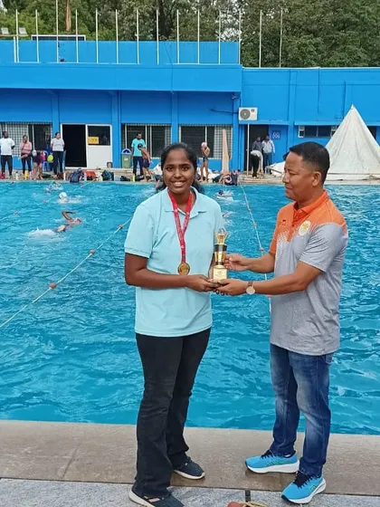 Nitya, one of our top athletes, receiving the 'Best Female Athlete' award at the NRJ State Senior Waterpolo Championship. This recognizes her outstanding performance and contribution to the team's victory.