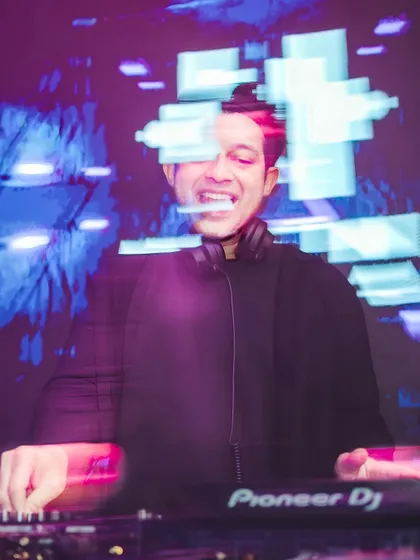 A motion-blur shot of me at the decks, capturing the energy.
