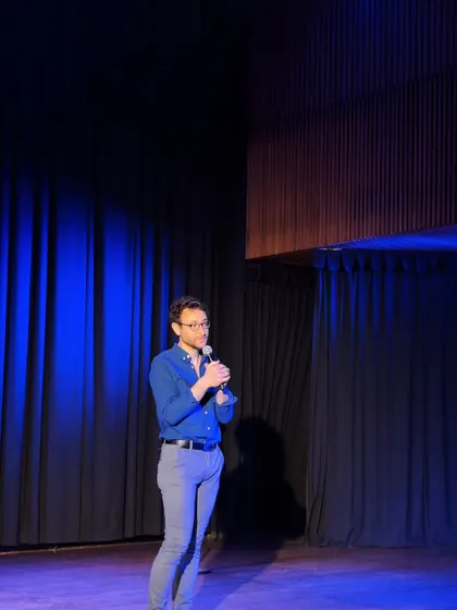 Comedian Sebastian Marx on our stage during his show. The simple, focused shot highlights the intimate and engaging nature of our stand-up comedy nights.