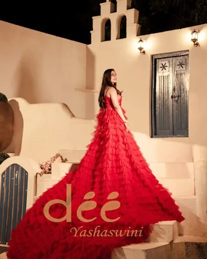 A beautiful shot of a client in our red ruffle gown, perfect for pre-wedding shoots or reception functions.