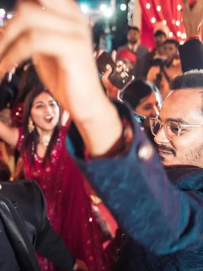 The groom and his friends lost in the moment during the baaraat. I focus on capturing these unposed interactions and expressions that truly reflect the spirit and fun of an Indian wedding.