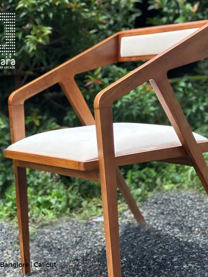 A close-up of the Zircon chair's frame, emphasizing the expert joinery and the smooth finish of the handcrafted teak wood.
