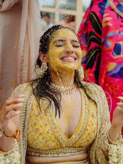Another angle of the bride's Haldi, capturing her infectious laughter. My goal is to create a relaxed atmosphere where everyone can be themselves and enjoy the moment.