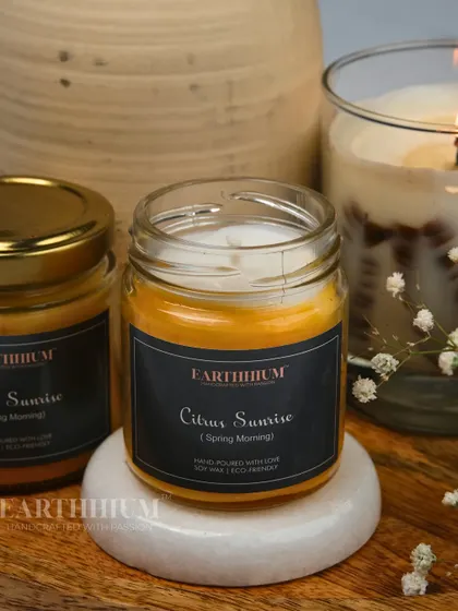 The 'Citrus Sunrise' jar candle is perfect for energizing your mornings with its bright, zesty fragrance.