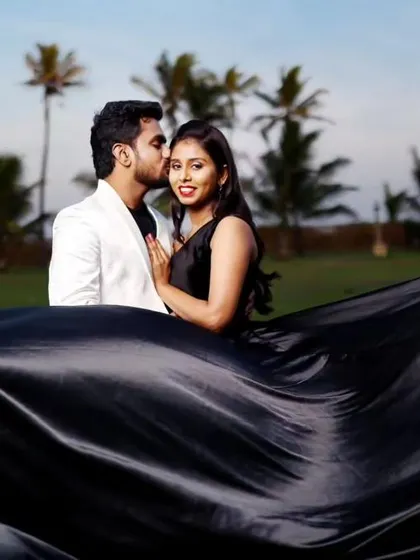 A sweet moment captured during a pre-wedding shoot. We offer many flying gowns and matching blazers for the perfect couple look.