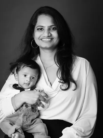 A timeless black and white portrait of a mother holding her baby. This classic style emphasizes the emotion and connection without any distractions.
