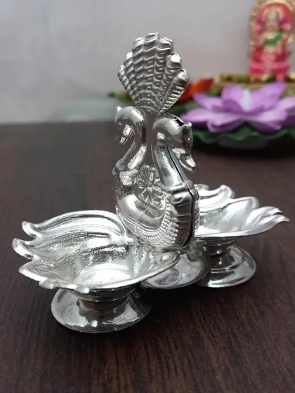 Another view of the German silver Kamal Hamsa kumkum daani, a symbol of purity and grace.