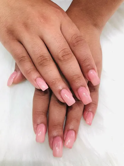 A classic set of square extensions with a semi-sheer pink polish for a natural but polished look.