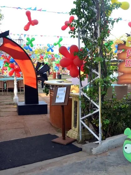 The entrance arch to "Aarav's Birthday Bash," an Angry Birds themed party, complete with character props to welcome guests.