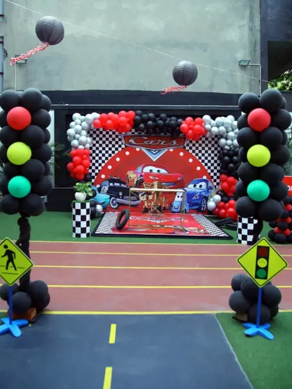 A full view of the racetrack setup for the Cars theme. I use traffic signs and balloon stoplights to make the entire outdoor area feel like a real race circuit.