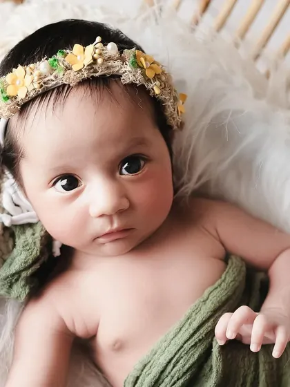 One little baby girl who just wouldn't sleep. And that's perfectly okay. We captured her beautiful, curious eyes in this simple, natural setup.